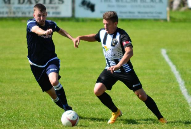 County Times: Action from the Bow Street Ardal North East League clash with Rhos Aelwyd.  Photo by Beverley Hemmings.